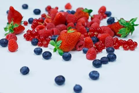 Assorted fresh berries with white background Stock Photos