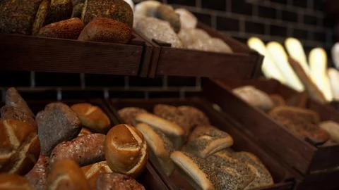 Assorted Fresh Breads Displayed on Store Shelf Stock Illustration