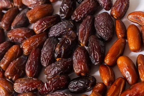 Assorted Fresh Dates Close-Up on White Background Stock Photos