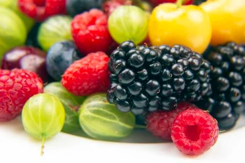 Assorted fresh different berries on a white background. useful vitamin health Stock Photos