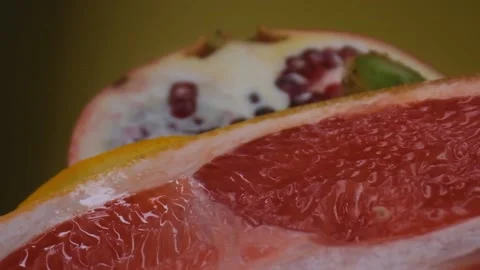 Assorted fresh fruit, grapefruit,splashes of water on fruit, fresh juice Stock Footage 131603178