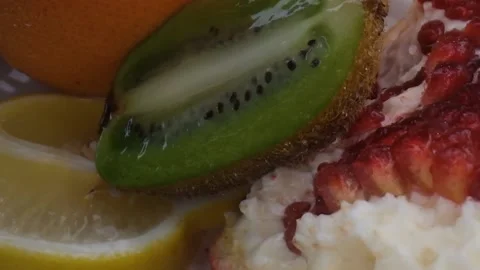 Assorted fresh fruit, grapefruit,splashes of water on fruit, fresh juice Stock Footage 131605086