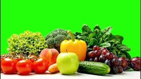 Assorted Fresh Fruits and Vegetables on Green Screen Isolated for Chroma Key Stock Footage 317932884