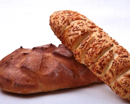 Assorted Fresh homemade bread on white background. Selective focus Stock Photos