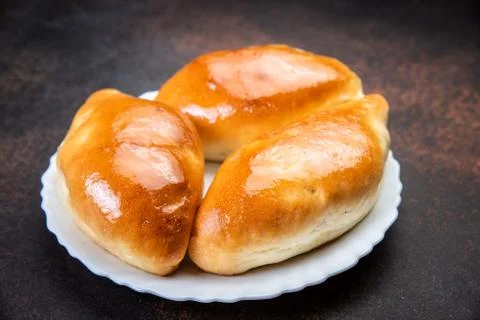 Assorted fresh lush buns and pies Stock Photos