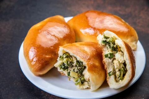 Assorted fresh lush buns and pies Stock Photos