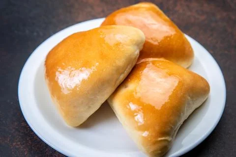 Assorted fresh lush buns and pies Stock Photos