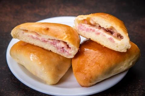 Assorted fresh lush buns and pies Stock Photos
