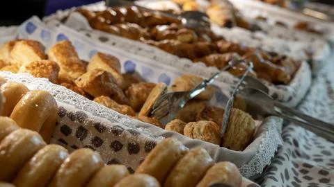 Assorted Fresh Pastries and Bread on a Buffet Table Stock Photos