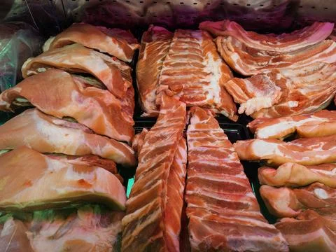 Assorted Fresh Raw Meat Cuts Display at Market Stock Photos