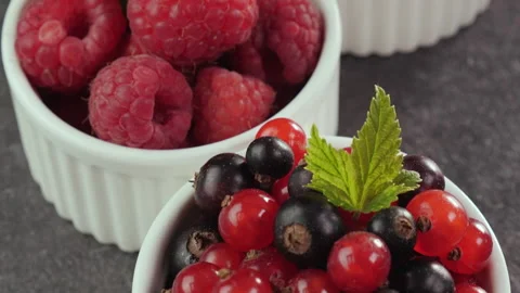 Assorted fresh summer fruits in small cups on the table Stock Footage 177986953