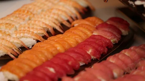 Assorted fresh sushi sashimi and rice on buffet 2 Stock Footage 123874785
