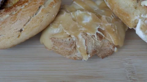 Assorted fresh traditional spanish biscuits with icing spread arranged on a Stock Footage 341508975