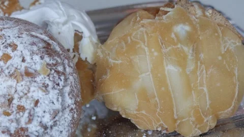 Assorted fresh traditional spanish bread rolls from Madrid, rosquillas de San Stock Footage 341499699