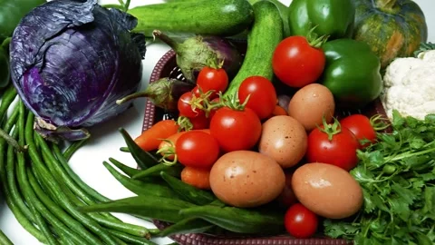 Assorted Fresh Vegetables and Eggs, A colorful assortment of fresh vegetabl.. 库存影片 305032764