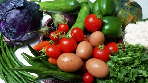 Assorted Fresh Vegetables and Eggs, A colorful assortment of fresh vegetabl.. 库存影片 305032860