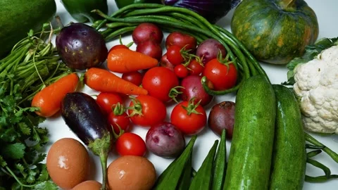 Assorted Fresh Vegetables and Eggs Footage, A colorful assortment of fresh .. Stock Footage 305033790
