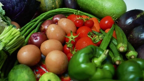 Assorted Fresh Vegetables and Eggs Footage, A colorful assortment of fresh .. Stock Footage 305039409