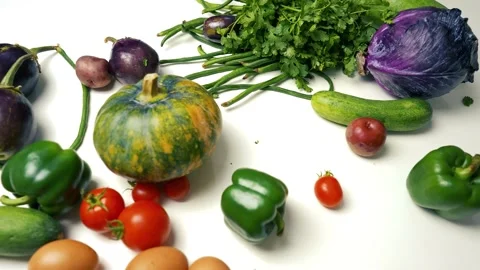 Assorted Fresh Vegetables and Eggs, A variety of fresh vegetables and eggs .. Stock Footage 305053768