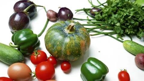 Assorted Fresh Vegetables and Eggs on White Surface, A variety of fresh veg.. Видео 305060367
