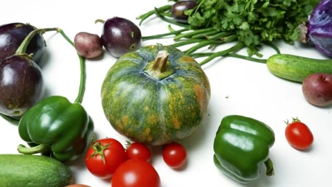 Assorted Fresh Vegetables and Eggs on White Surface, A variety of fresh veg.. 動画素材 305060383