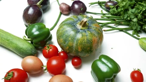 Assorted Fresh Vegetables and Eggs on White Surface, A variety of fresh veg.. Видео 305060398