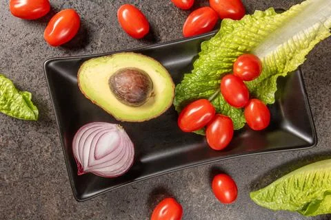 Assorted fresh vegetables arranged on dark background for still life photog.. Stock Photos