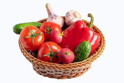 Assorted fresh vegetables in a basket on a white background. Eco food concept Stock Photos