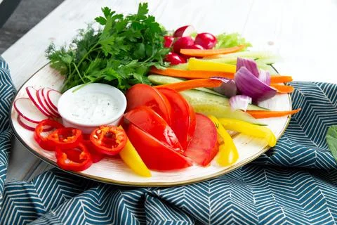 Assorted fresh vegetables in a plate. Stock Photos