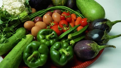 Assorted Fresh Vegetables on Red Tray, A colorful assortment of fresh veget.. Видео 305039171