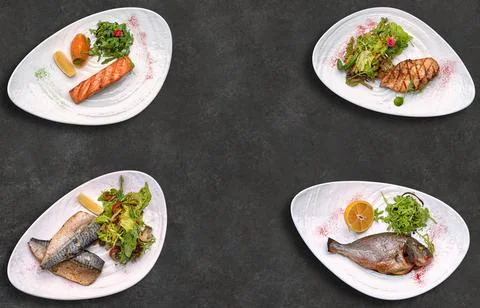 Assorted fried fish, on a dark background with space for text Stock Photos