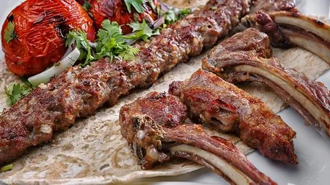 Assorted fried meat on lavash Stock Photos