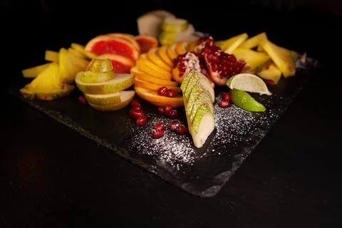 Assorted fruit on a black background Stock Photos