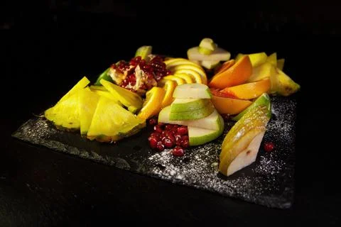 Assorted fruit on a black background Stock Photos