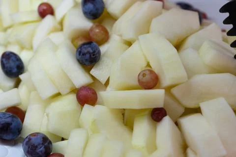 Assorted fruit - melon, plum, grapes. Fructarians food Stock Photos