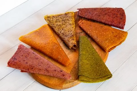 Assorted fruit pastille slices in different colors laid out in circular pat.. Stock Photos