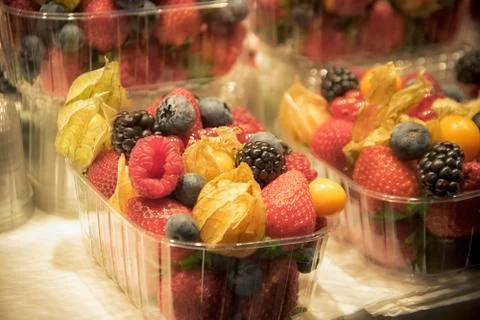 Assorted Fruit in Plastic Boxes Stock Photos