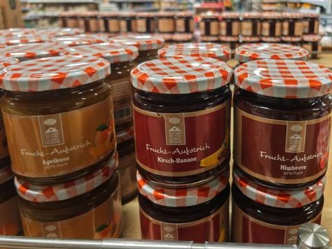Assorted Fruit Preserves in Jars at Grocery Store Stock Photos