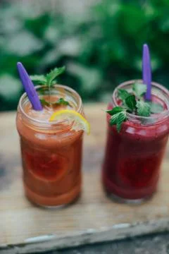 Assorted fruit shakes on white table. Smoothie concept. Selection of colorful Stock Photos