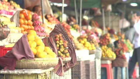 Assorted fruits in baskets in a marektplace Stock Footage 241347345