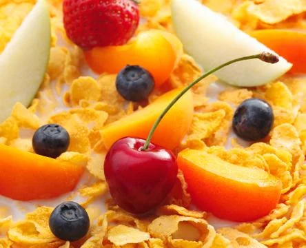 Assorted fruits on cornflakes Stock Photos