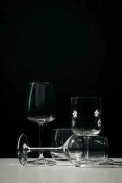 Assorted glassware for various drinks in sunlight Stock Photos