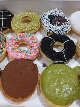Assorted Glazed Donuts in a Box Stock Photos