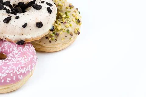Assorted glazed donuts with copy space on light background Stock-Fotos