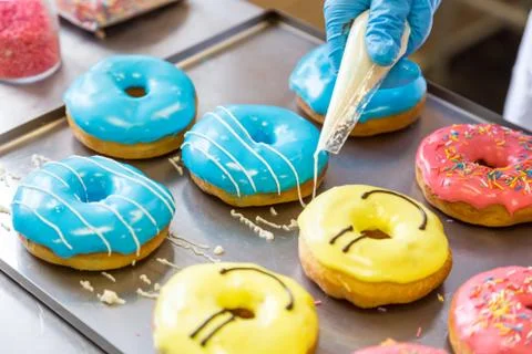 Assorted glazed doughnuts in different colors Stock-Fotos