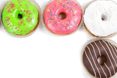 Assorted glazed doughnuts in different colors Foto stock