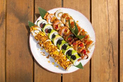 Assorted gourmet sushi roll set with salmon, tuna, shrimp, avocado, black a.. Фото