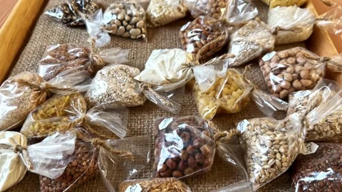 Assorted Grains and Beans in Clear Plastic Bag Stock Footage 326019998