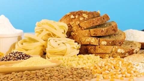 Assorted Grains and Breads on Blue Background 库存影片 307829128