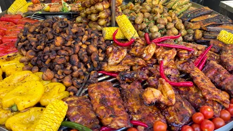 Assorted grilled meat and vegetables on barbecue grill Stock Footage 318544901